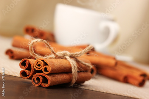 Cinnamon and beverage cup on wooden table series - 4