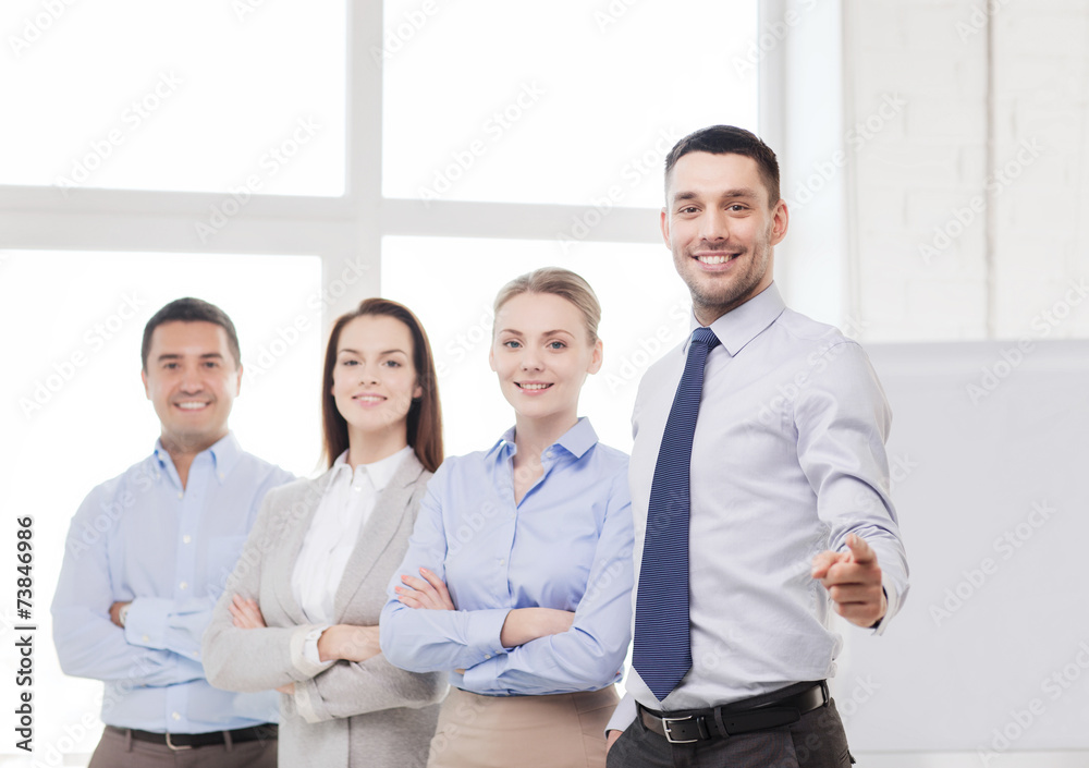 businessman in office pointing finger at you businessman in office pointing finger at you