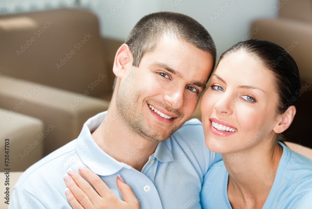 Young happy smiling attractive couple at home Young happy smiling attractive couple at home