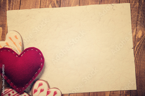 Postcard Valentine's Day. Toy heart shaped handmade with cookies