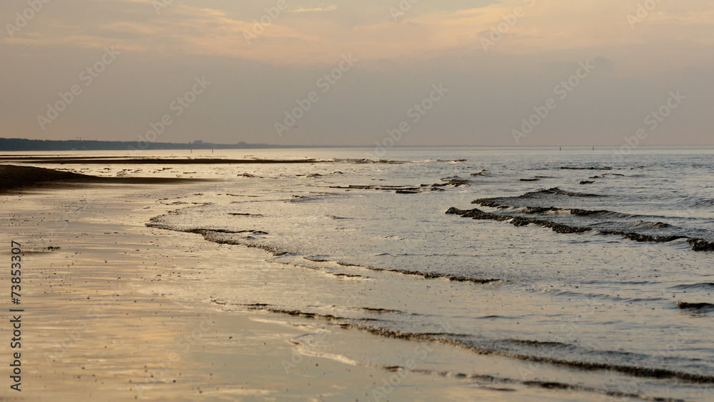 Evening Sand beach in Baltic sea , Riga Latvia Evening Sand beach in Baltic sea , Riga Latvia