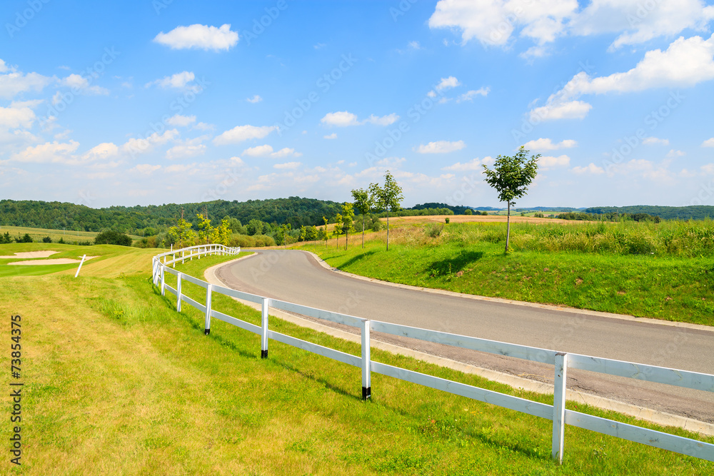 Obraz premium Road to golf playing area in Paczultowice village, Poland