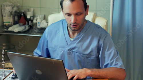 Doctor preparing teenager for brain scan in hospital photo