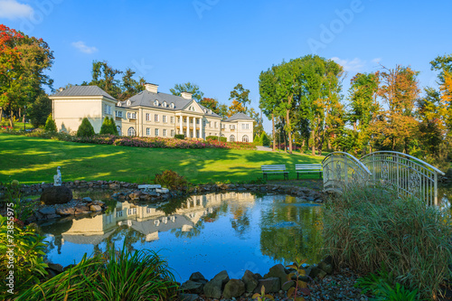 Reflection of Smilowice palace in small pond, Poland