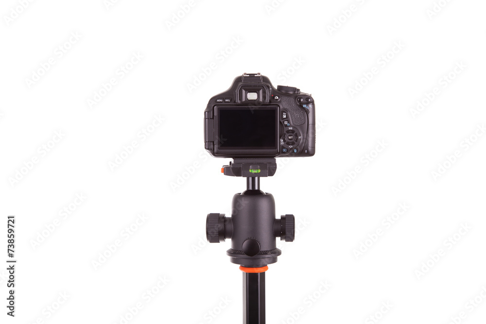 Digital camera mounted on tripod, isolated on white background