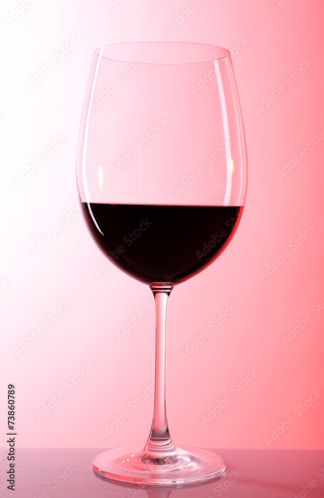 Red wine glass of wine on colorful background Red wine glass of wine on colorful background