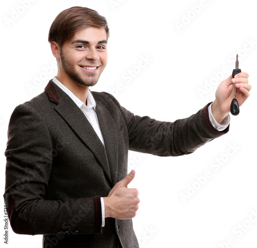 Businessman holding car key...