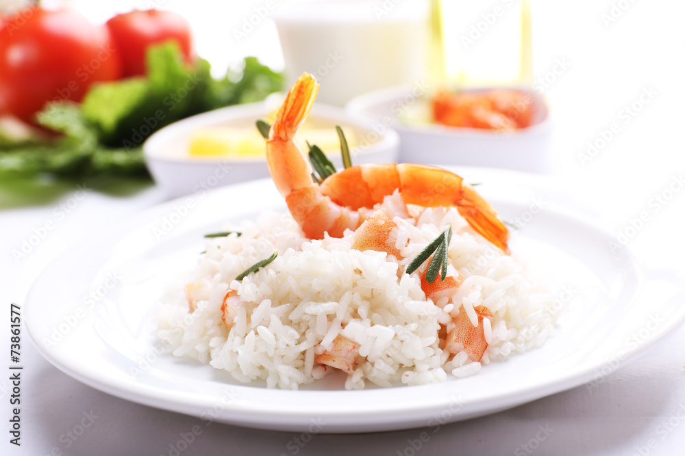 Boiled rice with shrimps served on table, close-up Boiled rice with shrimps served on table, close-up