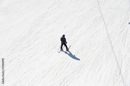Skier going down the slope at ski resort