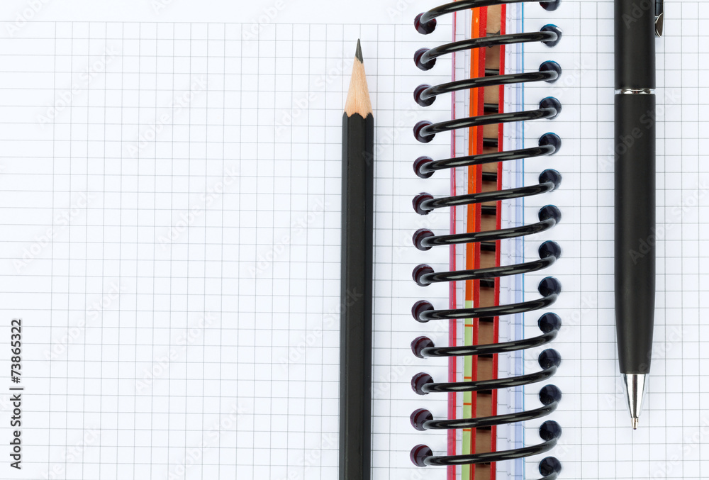 Blank notepad with pen and pencil