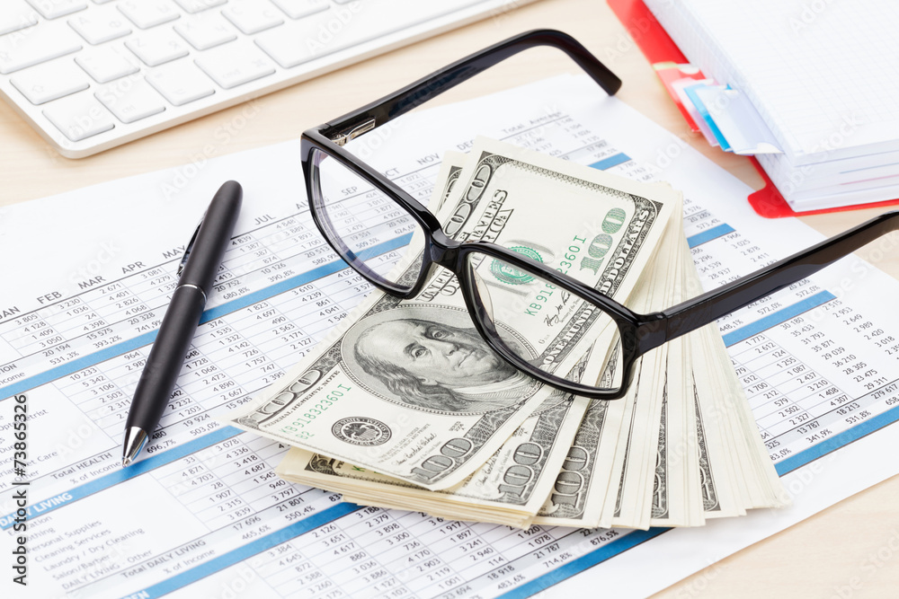 Office table with pc, supplies and money cash Office table with pc, supplies and money cash