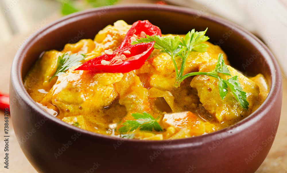 Chicken curry with parsley in bowl Chicken curry with parsley in bowl