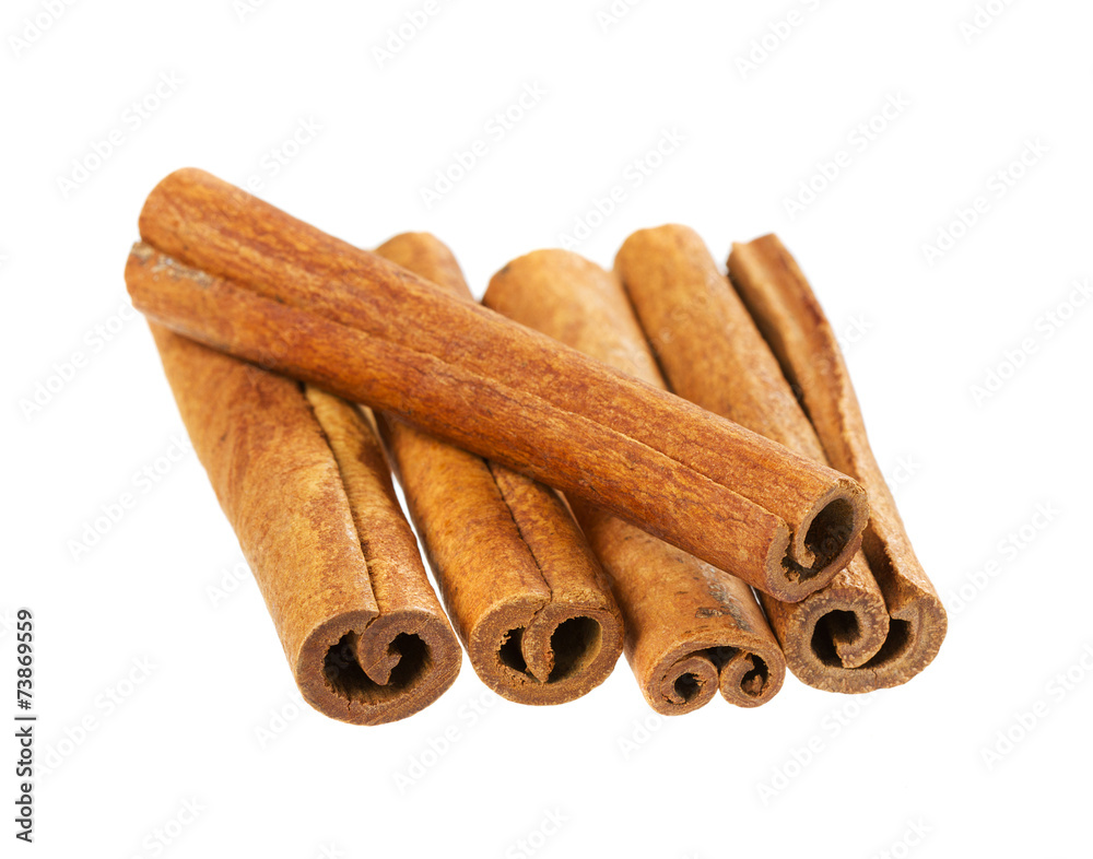 heap of cinnamon sticks isolated on white heap of cinnamon sticks isolated on white