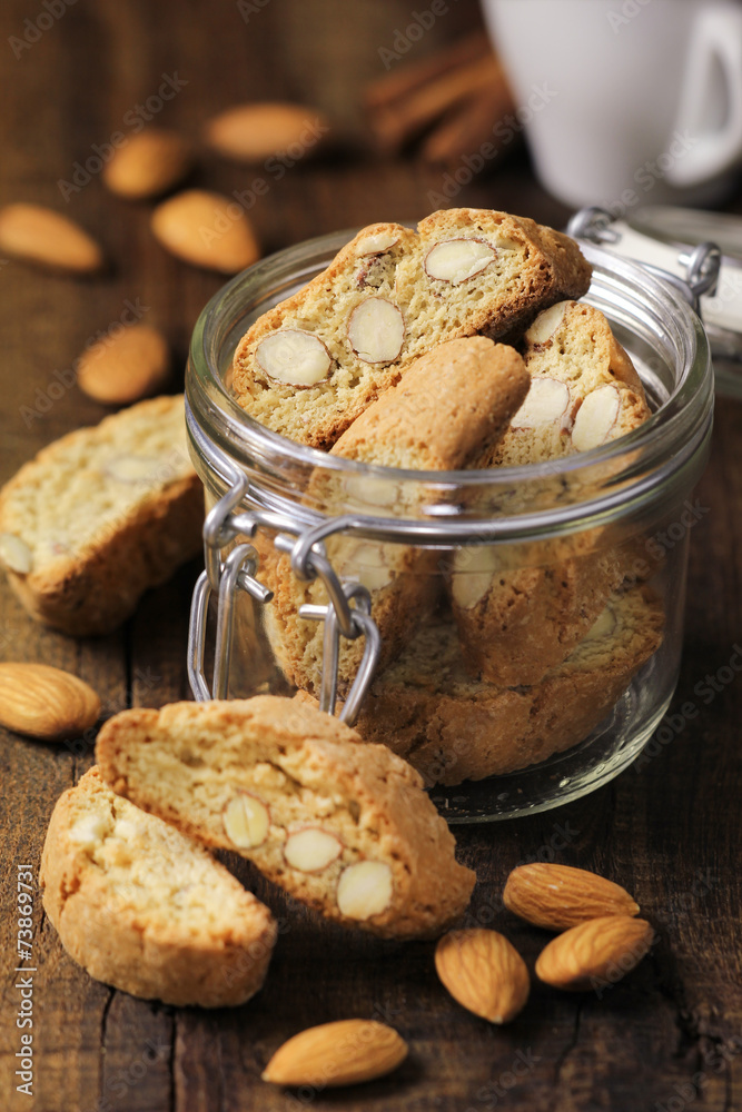 Italian Almond cantuccini in a glass jar with coffee Italian Almond cantuccini in a glass jar with coffee
