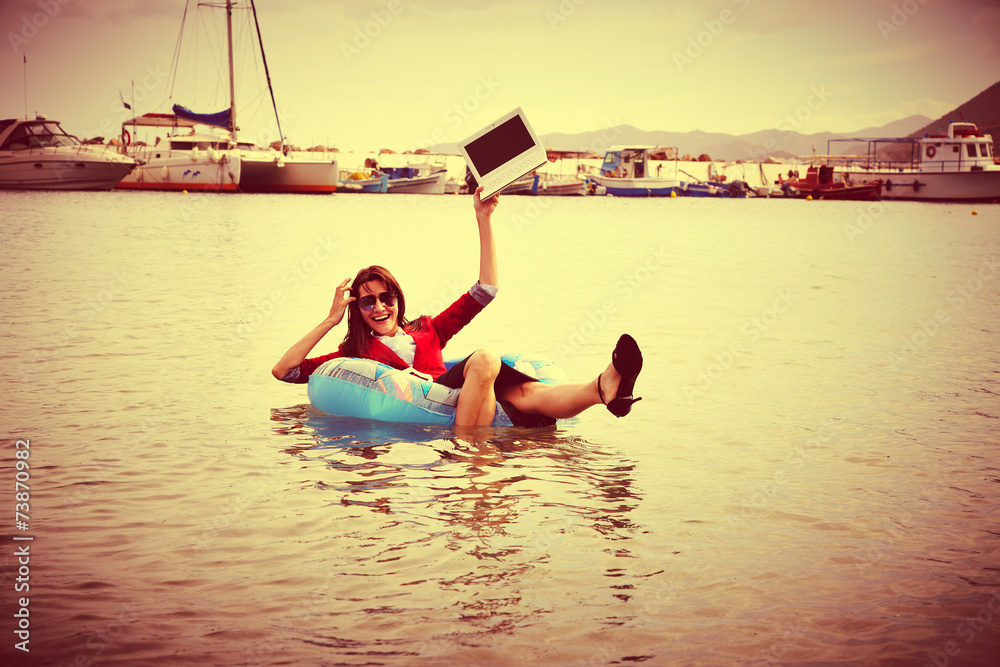 Happy  businesswoman floating in ocean- retro
