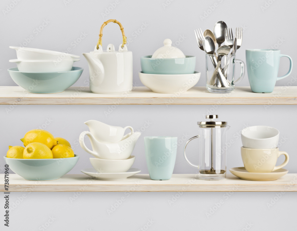 Kitchenware on wooden shelves Kitchenware on wooden shelves