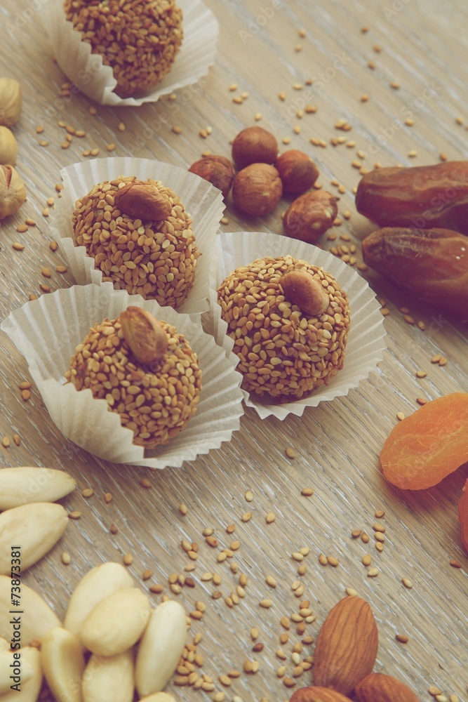 Fototapeta premium Homemade diet truffles with dried fruits and nuts