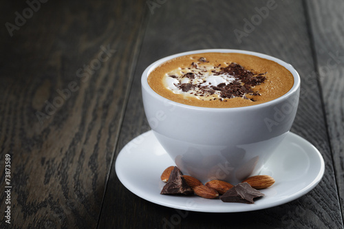 cup of freshly made cappuccino with latte art