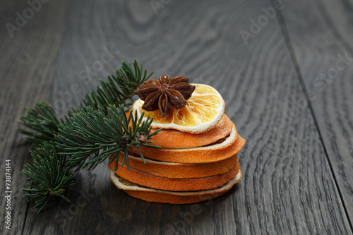 Fototapeta Naklejka Na Ścianę i Meble -  dried orange spruce twig and anise