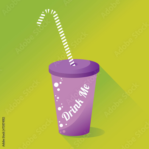 Violet tumbler with a straw. Green background