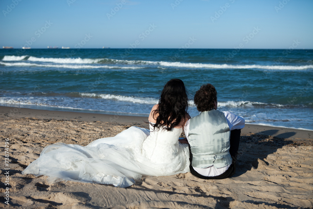 newlywed couple on the beach