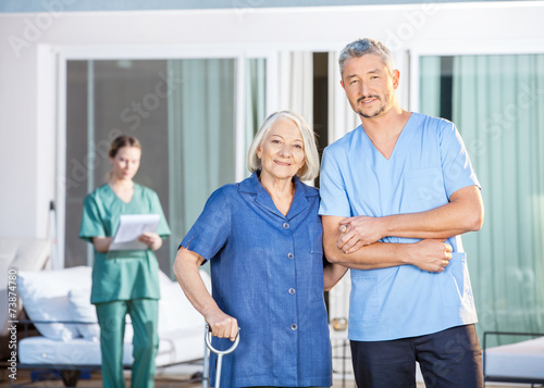 Confident Male Caretaker And Disabled Senior Woman © Tyler Olson