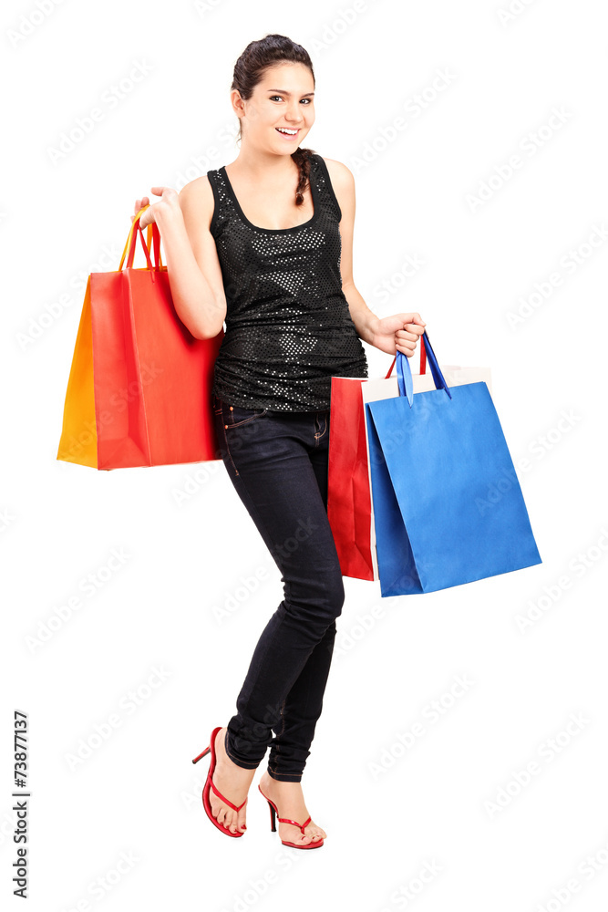 Fashionable female holding bunch of shopping bags Fashionable female holding bunch of shopping bags