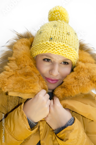 Beautiful fashionable young woman in winter clothes