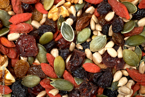 mix nuts seeds and dry fruits, on a wooden table