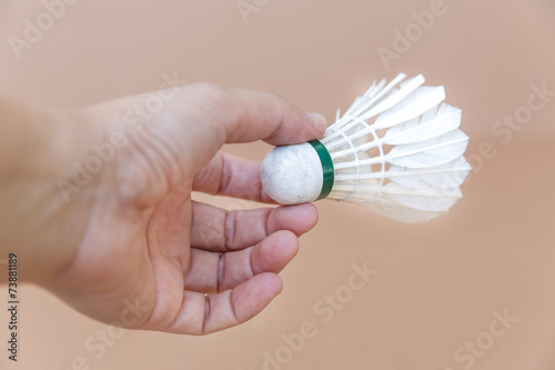 shuttlecock in human hand