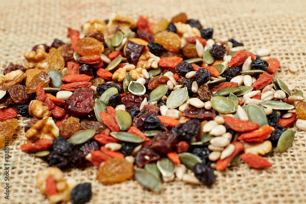mix nuts seeds and dry fruits, on a wooden table mix nuts seeds and dry fruits, on a wooden table