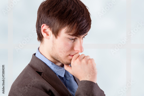 Young businessman in thinking photo