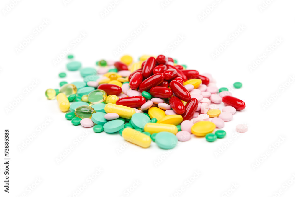 Stack of different pills isolated on white background