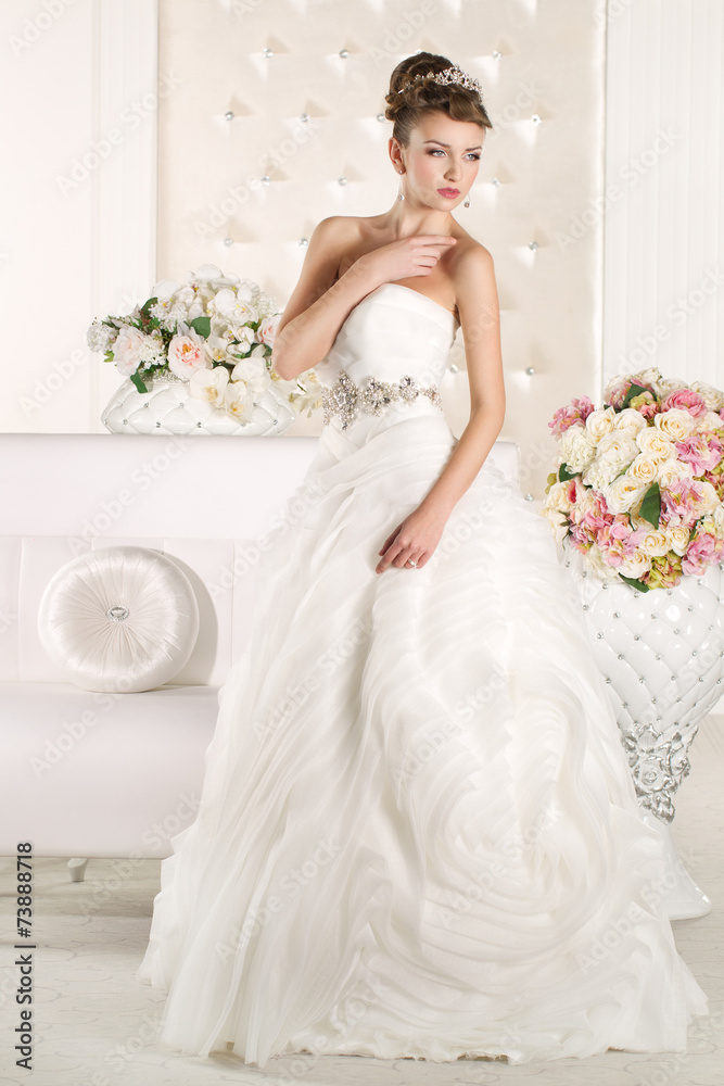 Gorgeous bride with white dress with flowers bouquet Gorgeous bride with white dress with flowers bouquet
