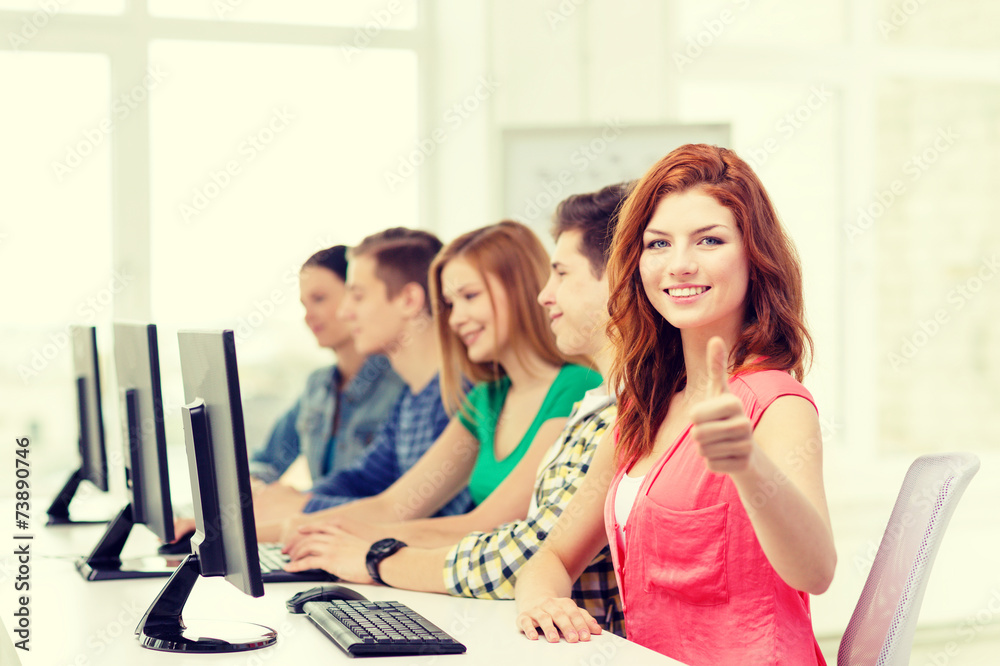female student with classmates in computer class female student with classmates in computer class