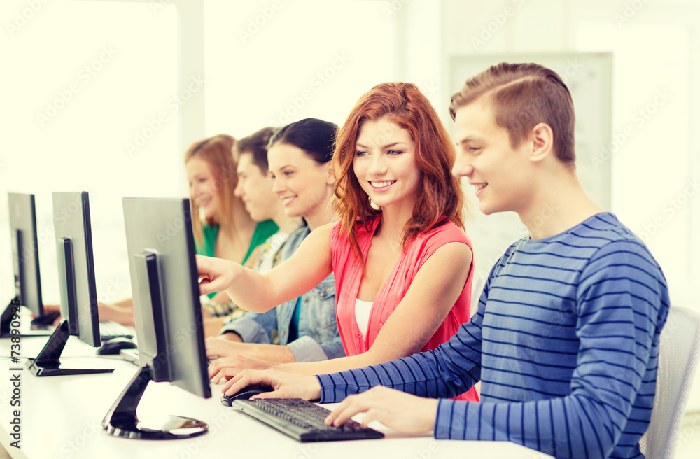 female student with classmates in computer class female student with classmates in computer class