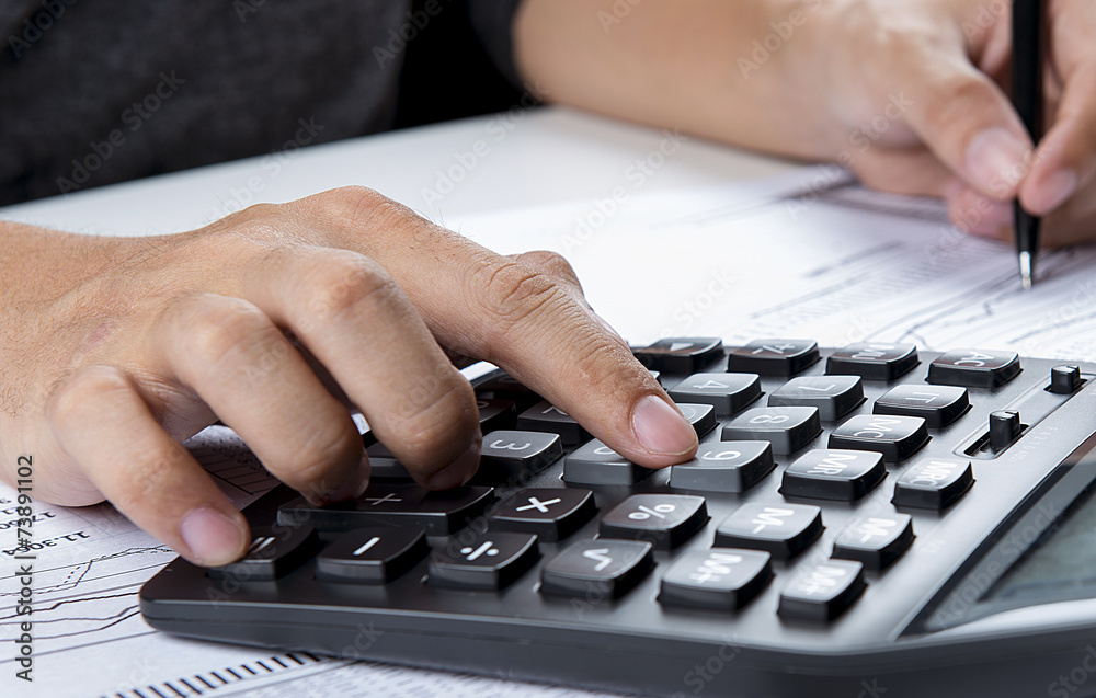 pressing calculator buttons over documents pressing calculator buttons over documents