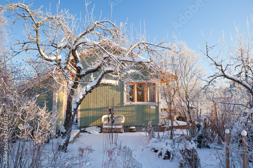 Summer cabin at winter photo