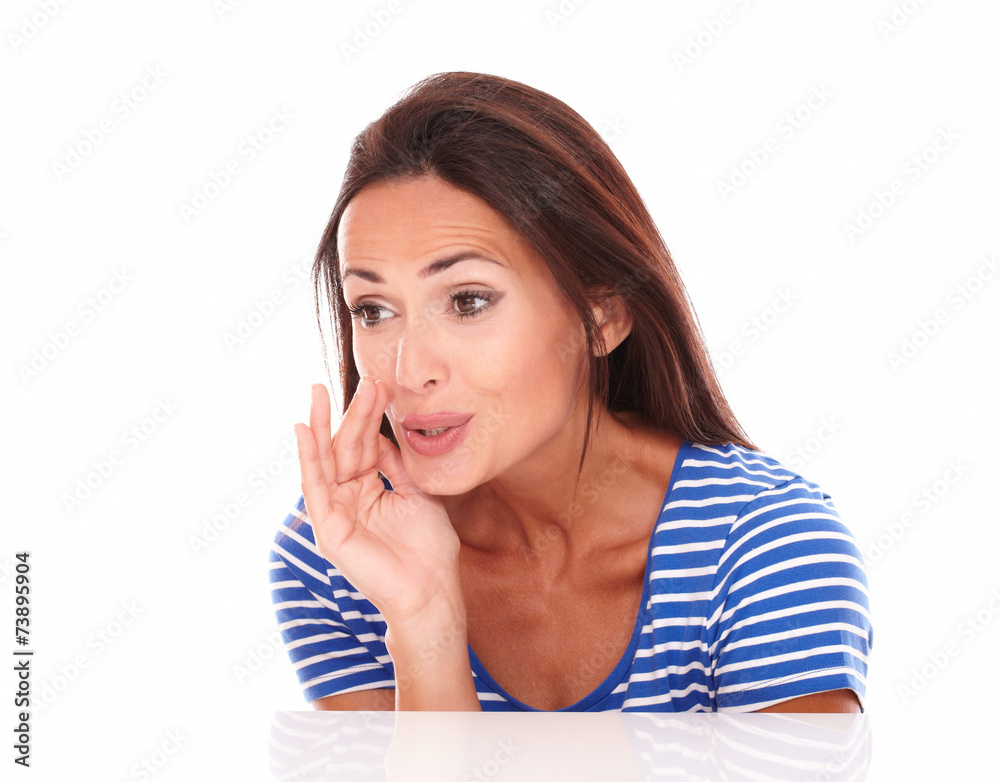 Pretty hispanic lady whispering a secret Pretty hispanic lady whispering a secret