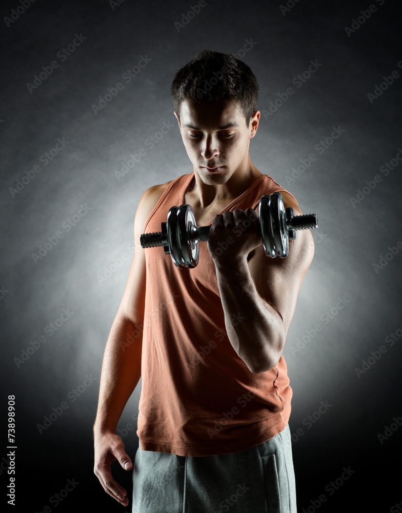 young man with dumbbell