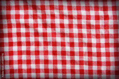 Texture of a red and white linen crumpled tablecloth.