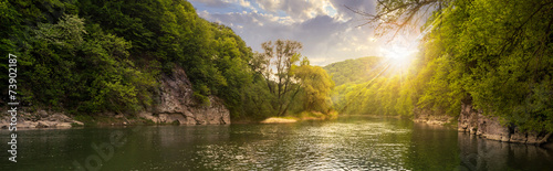 Fotografie, Tablou forest river with stones on shores at sunset