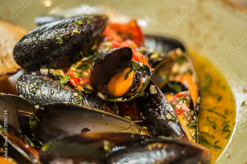 Moules Marinieres - Mussels cooked with white wine sauce. photo