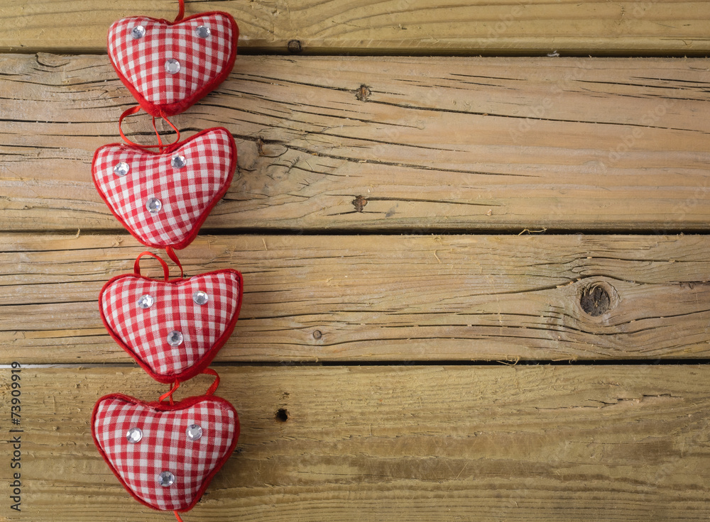 red check hearts on rustic wooden background red check hearts on rustic wooden background