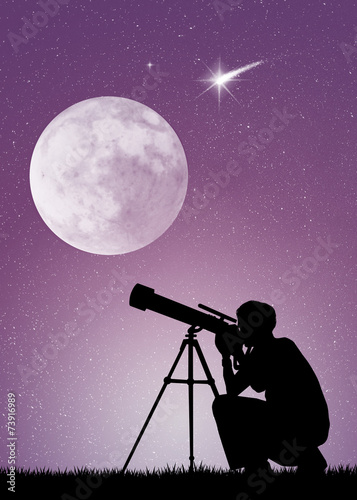 Man looks in the telescope
