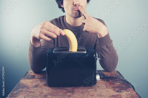 Man thinking about toasting banana