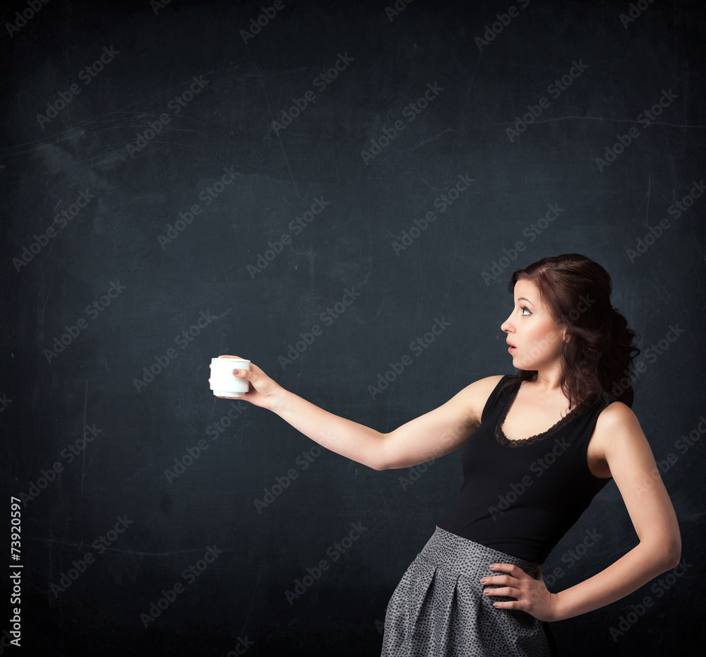 Businesswoman holding a white cup