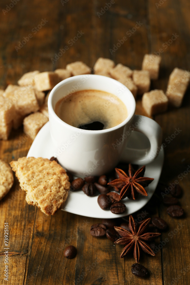 Cup of espresso and tasty cookie on wooden background Cup of espresso and tasty cookie on wooden background