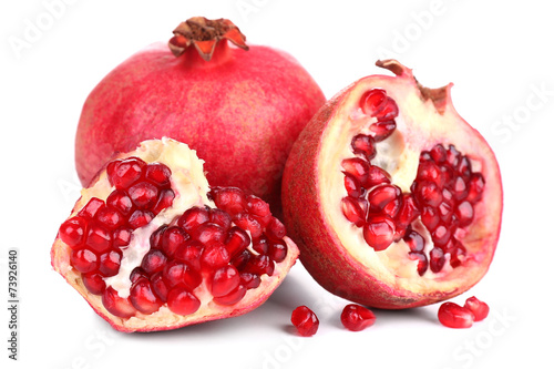 Juicy ripe pomegranates, isolated on white