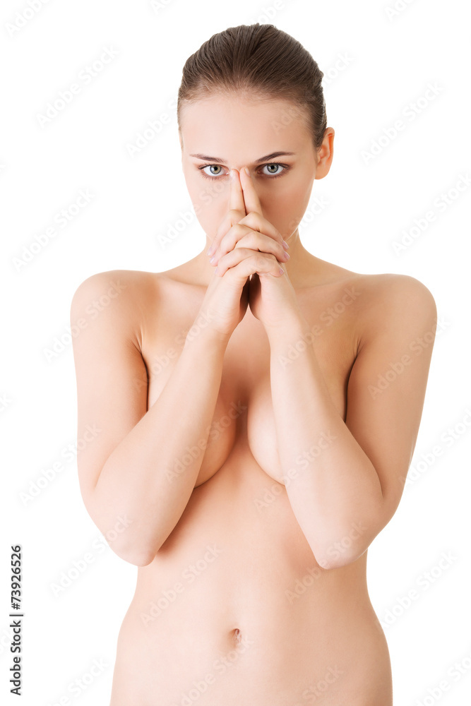 Fototapeta premium Portrait of nude woman making gun sign